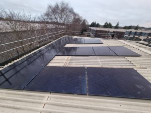 Solar panels installed on a commercial building in the UK.